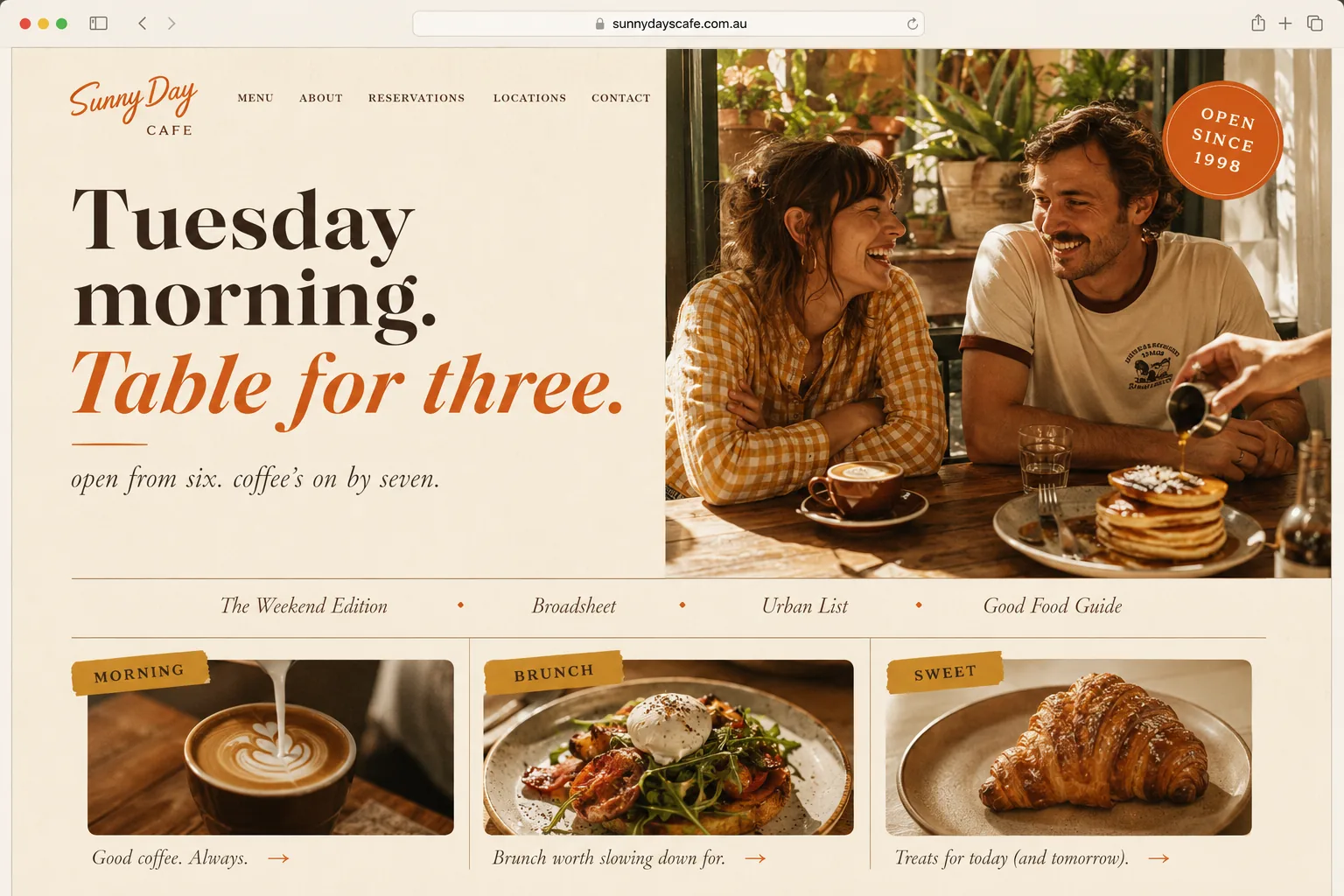 The Cafe skin. Warm cream brunch cafe website with pumpkin accent, vintage Open Since badge, sun-bleached photography of regulars at the bench seat.