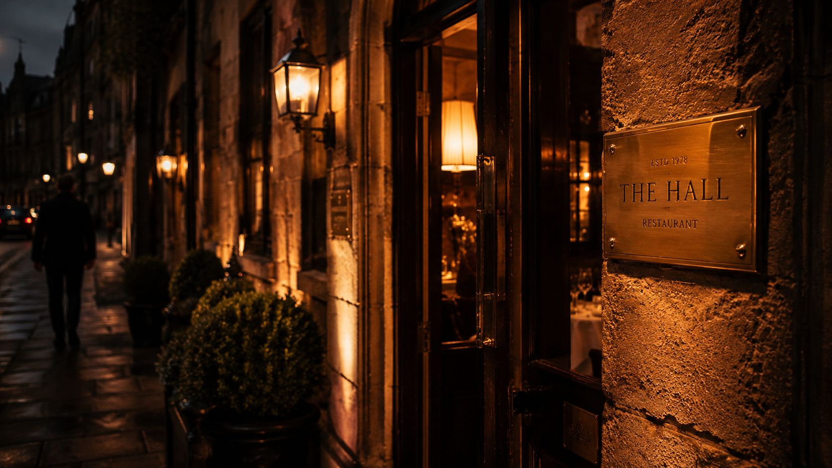 The exterior at dusk, brass plate and the door slightly ajar